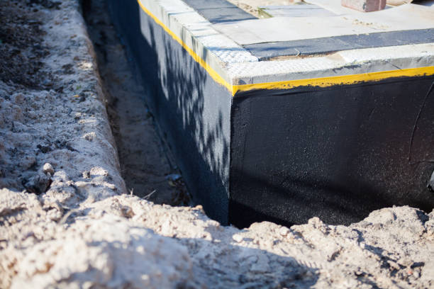 Professional Wet Basement Repair technician working in Sand Creek, MI